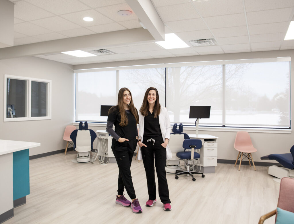 Picture of Dr. Adina Wolfe in office with staff in Quakertown PA